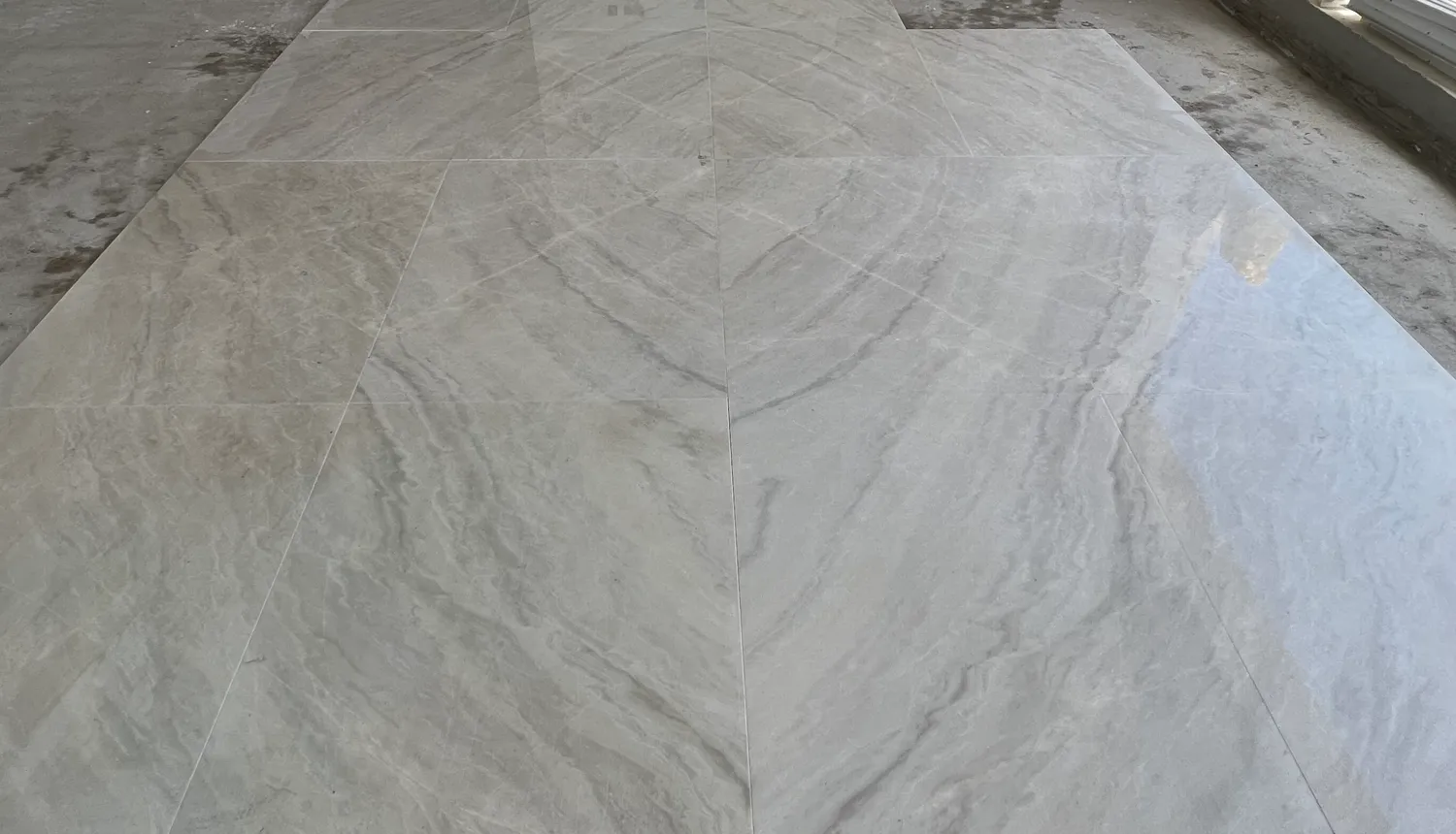 Book-matched marble slabs laid to a symmetric vein pattern